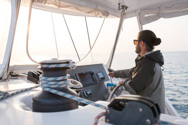 Skipper_at_the_Helm_Yacht_Charter