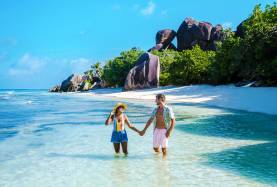 Couple in the water on a beach in Seychelles