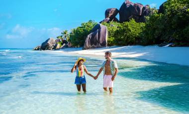 Couple in the water on a beach in Seychelles