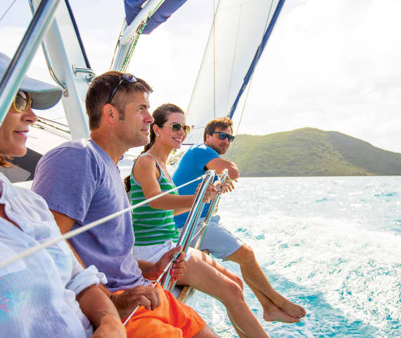Four people on sailing yacht
