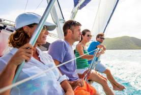 Four people on sailing yacht