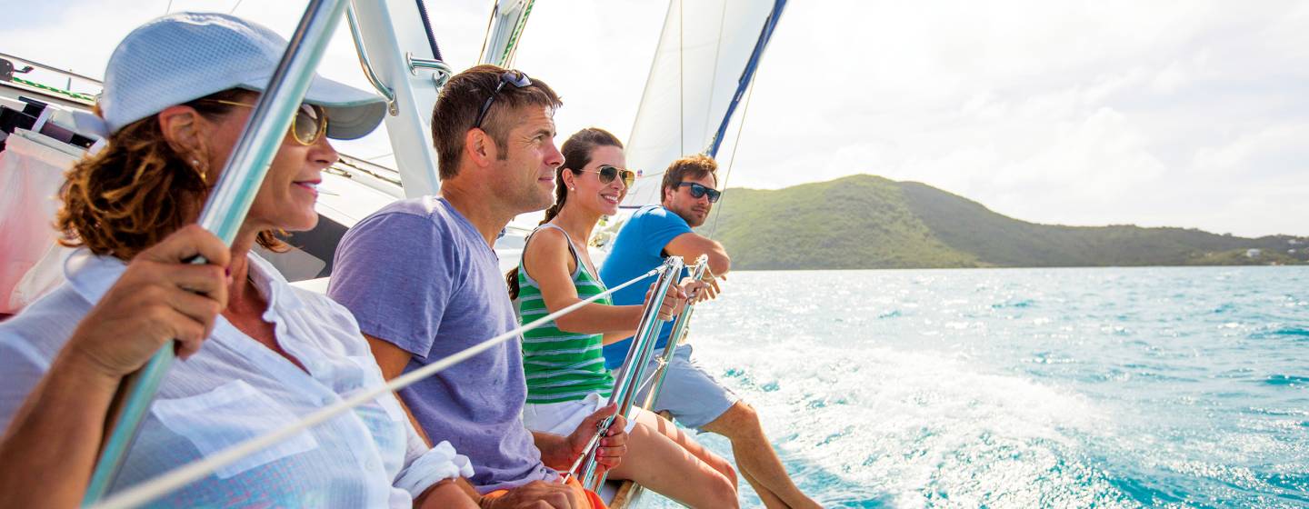 Four people on sailing yacht